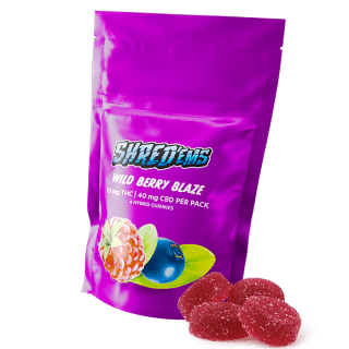 A purple bag of Shred'ems Wild Berry Blaze gummies.
